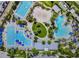 Aerial view of multiple pools, seating, and parking at the community pool at 14129 Walcott Ave, Orlando, FL 32827