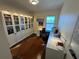 Bright home office featuring built-in bookcases, a large window, and plenty of desk space at 14129 Walcott Ave, Orlando, FL 32827