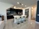 Modern kitchen features dark wood cabinets, quartz counters, stainless appliances, and a breakfast bar at 14129 Walcott Ave, Orlando, FL 32827