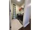 Functional laundry room with modern washer and dryer, shelving, and bright lighting at 14129 Walcott Ave, Orlando, FL 32827