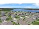 Aerial view of the neighborhood with a lake in the background at 14419 Topaghan Way, Winter Garden, FL 34787