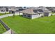 Fenced backyard featuring solar panels and a well-maintained lawn; perfect for privacy and energy efficiency at 14419 Topaghan Way, Winter Garden, FL 34787