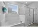 Bright bathroom featuring a tub and glass shower enclosure at 14419 Topaghan Way, Winter Garden, FL 34787