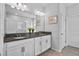 Bathroom with double sink vanity and granite countertops at 14419 Topaghan Way, Winter Garden, FL 34787