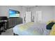 Comfortable bedroom with carpet floors and a TV mounted above the dresser at 14419 Topaghan Way, Winter Garden, FL 34787