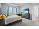 Cozy bedroom with carpet, a TV, and natural lighting at 14419 Topaghan Way, Winter Garden, FL 34787
