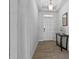 Welcoming entryway with tile floors, console table, and front door at 14419 Topaghan Way, Winter Garden, FL 34787