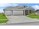 Charming single Gathering home with a well manicured lawn and 2-car garage at 14419 Topaghan Way, Winter Garden, FL 34787