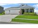 Charming single Gathering home with a well manicured lawn and 2-car garage at 14419 Topaghan Way, Winter Garden, FL 34787
