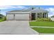 Charming single Gathering home with a well manicured lawn and 2-car garage at 14419 Topaghan Way, Winter Garden, FL 34787