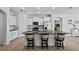 Well-appointed kitchen with granite countertops, a center island, and stainless steel appliances at 14419 Topaghan Way, Winter Garden, FL 34787