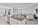 Open concept living space showcases the seamless flow of the kitchen and living room at 14419 Topaghan Way, Winter Garden, FL 34787