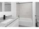 Bathroom featuring gray countertops, a white sink, bathtub, and chrome shower at 1449 Monte Carlo Trl, Orlando, FL 32805