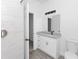 Bathroom featuring a shower, granite countertop vanity, and modern fixtures and finishes at 1449 Monte Carlo Trl, Orlando, FL 32805