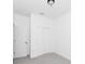Bedroom with gray carpet, white walls, and a double door closet at 1449 Monte Carlo Trl, Orlando, FL 32805