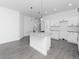 Spacious kitchen with white cabinets, granite countertops, and stainless steel appliances at 1449 Monte Carlo Trl, Orlando, FL 32805