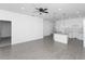 Open concept living space featuring gray tile floors and a modern ceiling fan at 1449 Monte Carlo Trl, Orlando, FL 32805