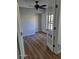 Bedroom featuring beautiful flooring, a ceiling fan, and a glass door leading outside at 2031 Dixie Belle Dr # Q, Orlando, FL 32812