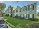 View of the charming apartment complex featuring well-manicured landscaping at 2031 Dixie Belle Dr # Q, Orlando, FL 32812