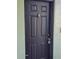 Close up of the dark front door with a door knocker and unit number at 2031 Dixie Belle Dr # Q, Orlando, FL 32812
