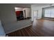 Bright and open living area showcasing hardwood floors and a kitchen view at 2031 Dixie Belle Dr # Q, Orlando, FL 32812