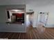 Bright living room with beautiful flooring and view into the kitchen area at 2031 Dixie Belle Dr # Q, Orlando, FL 32812