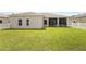 A spacious backyard with lush green grass and a white picket fence at 213 Strathmore Cir, Kissimmee, FL 34744