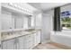 Bathroom features double vanity, granite countertops, soaking tub, and tiled shower at 213 Strathmore Cir, Kissimmee, FL 34744
