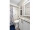 Clean bathroom featuring a shower-tub combo, granite vanity, and nautical decor at 213 Strathmore Cir, Kissimmee, FL 34744