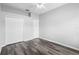 Bedroom features a ceiling fan and closet space at 213 Strathmore Cir, Kissimmee, FL 34744