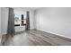 Bedroom features a large window with neutral walls and updated flooring at 213 Strathmore Cir, Kissimmee, FL 34744