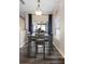 Cozy dining area with modern table set and plenty of natural light at 213 Strathmore Cir, Kissimmee, FL 34744