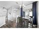 Dining room features a modern chandelier, and adjacent sliding glass doors leading to patio at 213 Strathmore Cir, Kissimmee, FL 34744
