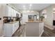 Kitchen featuring granite countertops, white cabinets, and stainless steel appliances at 213 Strathmore Cir, Kissimmee, FL 34744