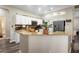 Kitchen featuring granite countertops, white cabinets, and stainless steel appliances at 213 Strathmore Cir, Kissimmee, FL 34744