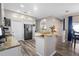 Kitchen featuring granite countertops, white cabinets, and stainless steel appliances at 213 Strathmore Cir, Kissimmee, FL 34744
