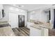 Bright kitchen features stone countertops, stainless appliances, and tile backsplash at 213 Strathmore Cir, Kissimmee, FL 34744