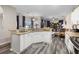 Kitchen featuring granite countertops, white cabinets, and stainless steel appliances at 213 Strathmore Cir, Kissimmee, FL 34744