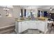 Kitchen featuring granite countertops, white cabinets and stainless steel appliances at 213 Strathmore Cir, Kissimmee, FL 34744