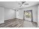 Bright living room with ceiling fan, and updated flooring at 213 Strathmore Cir, Kissimmee, FL 34744