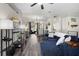 Bright living room with modern decor, an archway and seamlessly connecting to other living spaces at 213 Strathmore Cir, Kissimmee, FL 34744