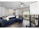 Inviting living area with a bright window, comfy seating, and stylish decor at 213 Strathmore Cir, Kissimmee, FL 34744