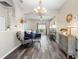 Inviting living room featuring high ceilings and a decorative chandelier at 213 Strathmore Cir, Kissimmee, FL 34744