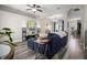 Inviting living room featuring wood floors, comfortable seating, and stylish decor at 213 Strathmore Cir, Kissimmee, FL 34744