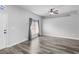 Bright living room boasts natural light, neutral color scheme and updated flooring at 213 Strathmore Cir, Kissimmee, FL 34744