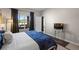 Comfortable main bedroom with large window and access to screened outdoor space at 213 Strathmore Cir, Kissimmee, FL 34744