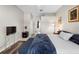 Spacious main bedroom with wood floors, sitting area, and en-suite bathroom access at 213 Strathmore Cir, Kissimmee, FL 34744