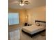 Spacious bedroom with marble floors, a double bed and a window that allows natural light to enter at 2320 Andrews Valley Dr, Kissimmee, FL 34758