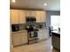 Modern kitchen featuring stainless steel appliances, granite countertops and elegant white cabinetry at 2320 Andrews Valley Dr, Kissimmee, FL 34758