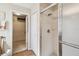 Bathroom with white shower, glass door, and closet space at 238 Acadia Dr, Poinciana, FL 34759